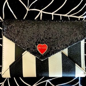 Never used Betsey johnson mini gold and black wallet